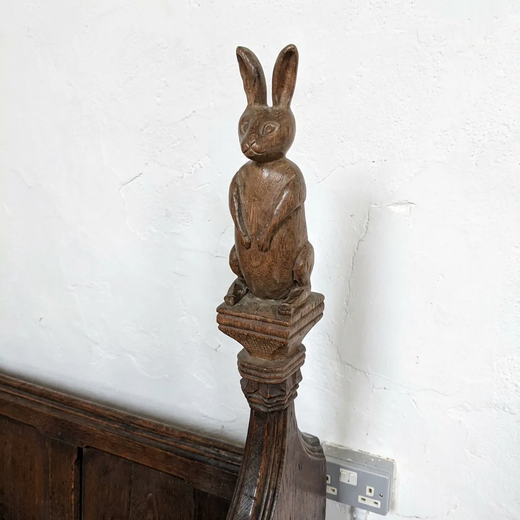 Poppy Head a decorative finial on a medieval bench end at St Andrews church 1331 Isleham cambridgeshire england